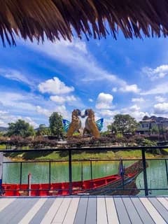 SeaVerse lake, red boat and sculptures pictured in the Hat Yai brochure